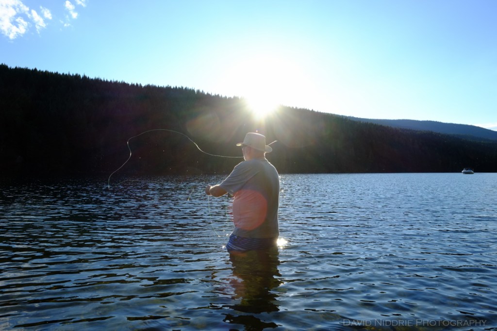 A man casts as he fly fishes the Clearwater River.