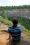 Jon sits on the edge of the Helmcken Falls&nbsp;canyon.