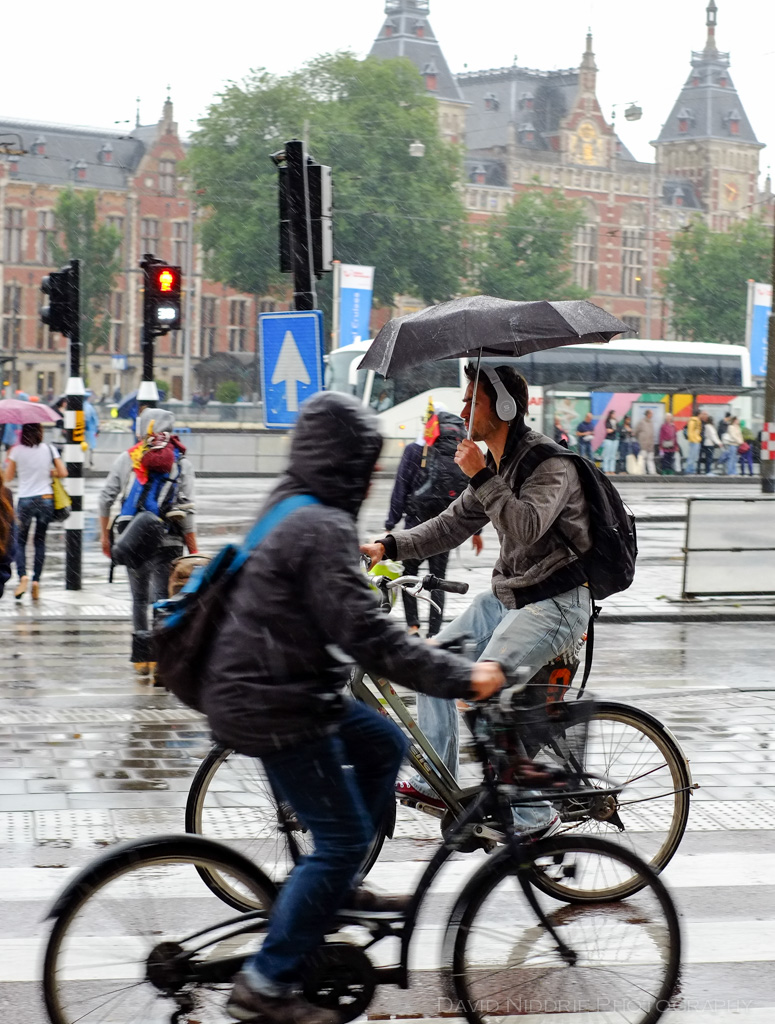 People cycling in the rain in Amsterdam.
