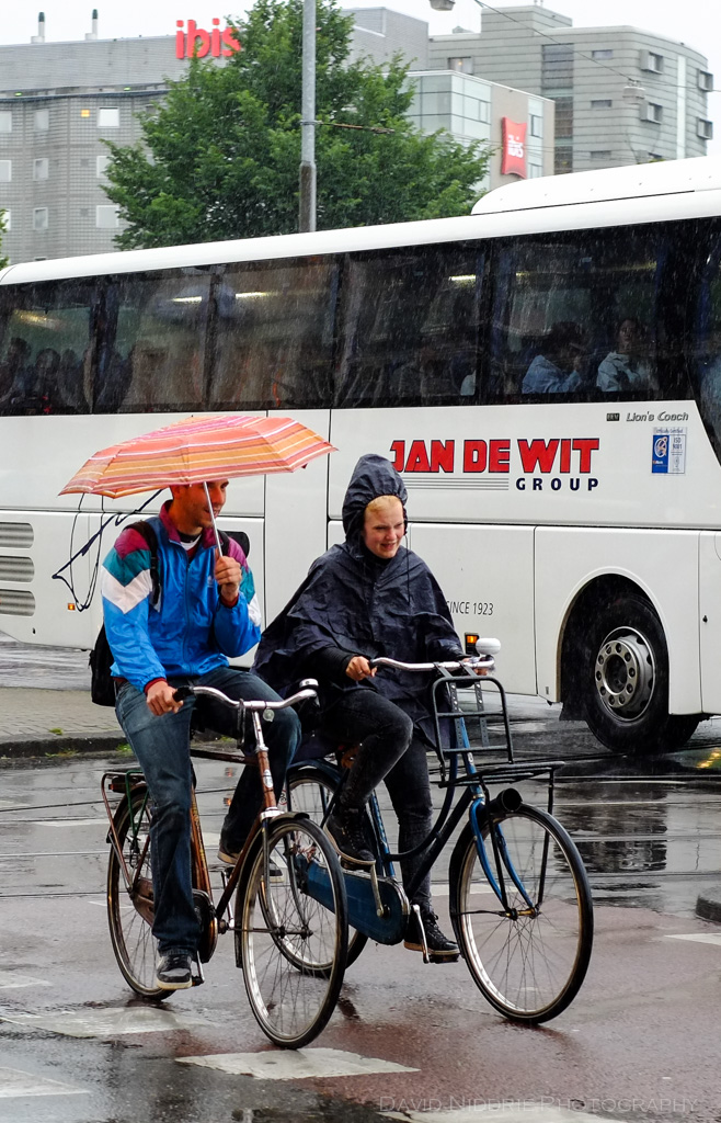 People cycling in the rain in Amsterdam.