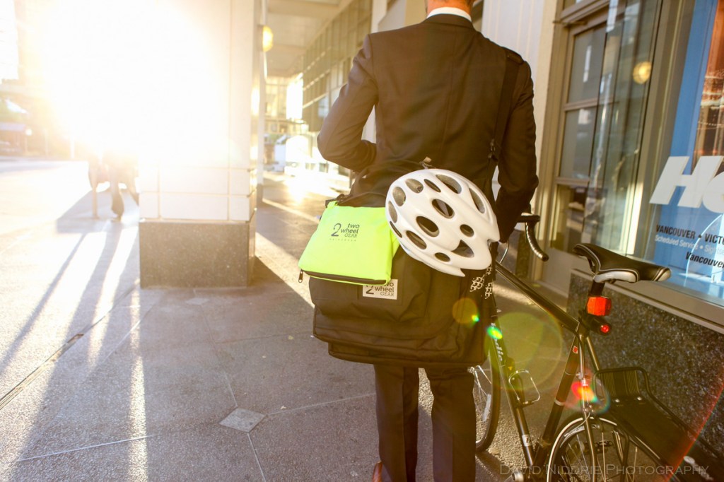 A man poses on a Vancouver street with Two Wheel Gear bicycle pannier.