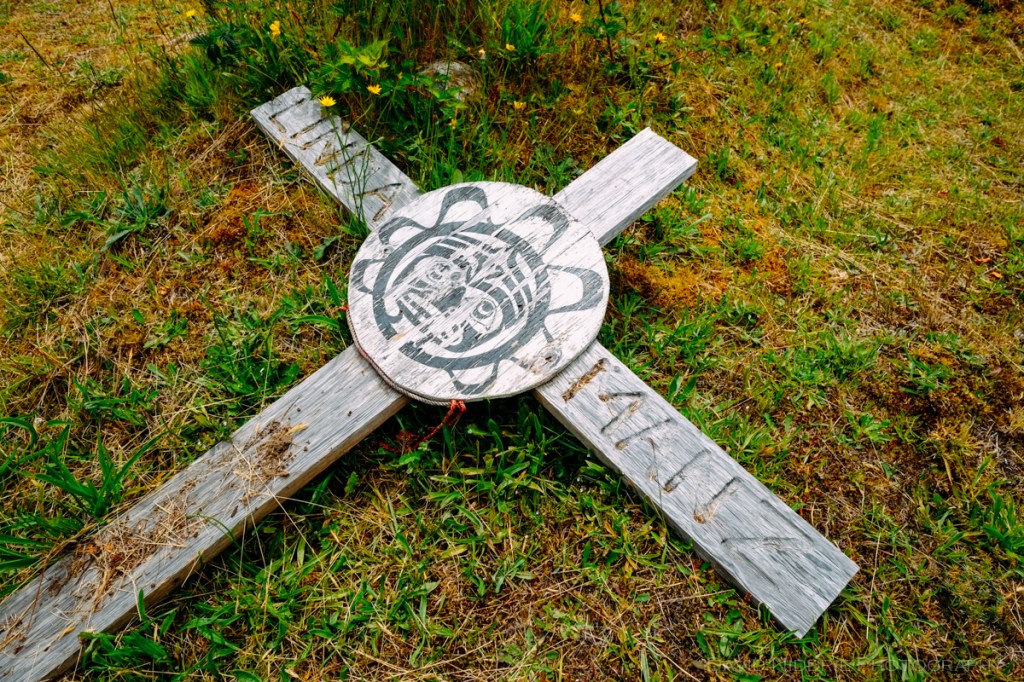 A cross rests at a graveyard in Alert Bay.