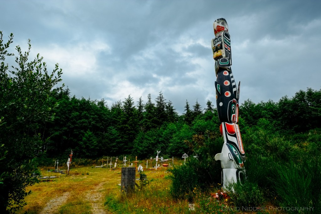 Totem poles stand tall at the traditional Namgis Burial Grounds on Alert Bay