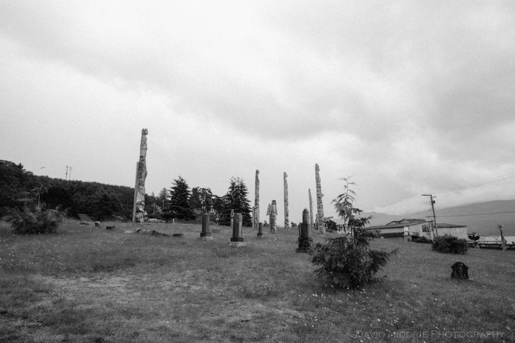 Totem poles stand tall at the traditional Namgis Burial Grounds on Alert Bay
