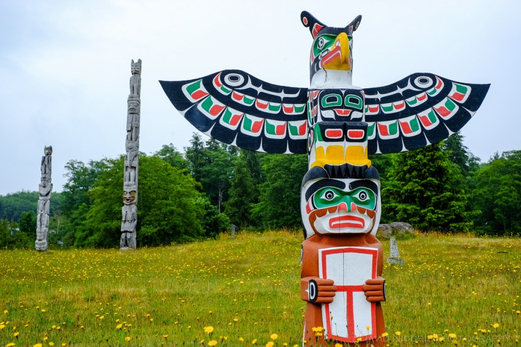 Totem poles stand tall at the traditional Namgis Burial Grounds on Alert Bay
