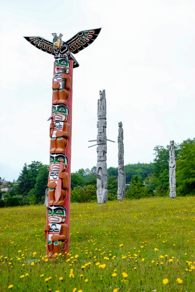 Totem poles stand tall at the traditional Namgis Burial Grounds on Alert Bay
