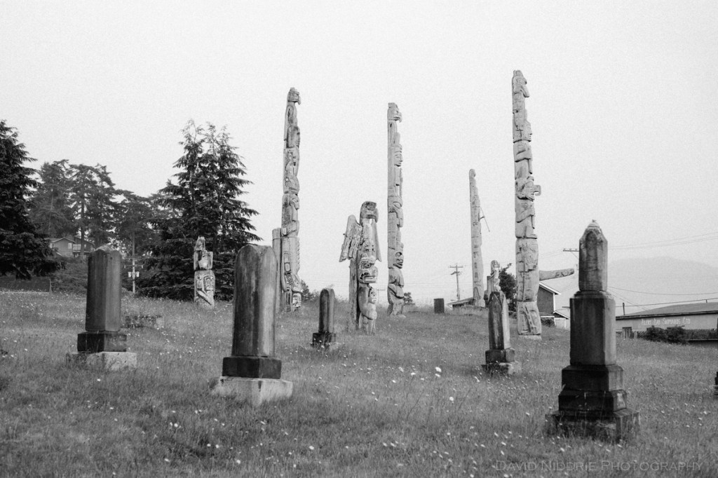 Totem poles stand tall at the traditional Namgis Burial Grounds on Alert Bay